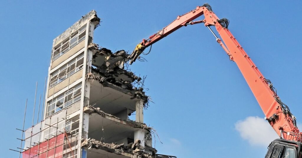 Image of High-Reach Excavators for Demolition: Top Uses & Safety Tips.